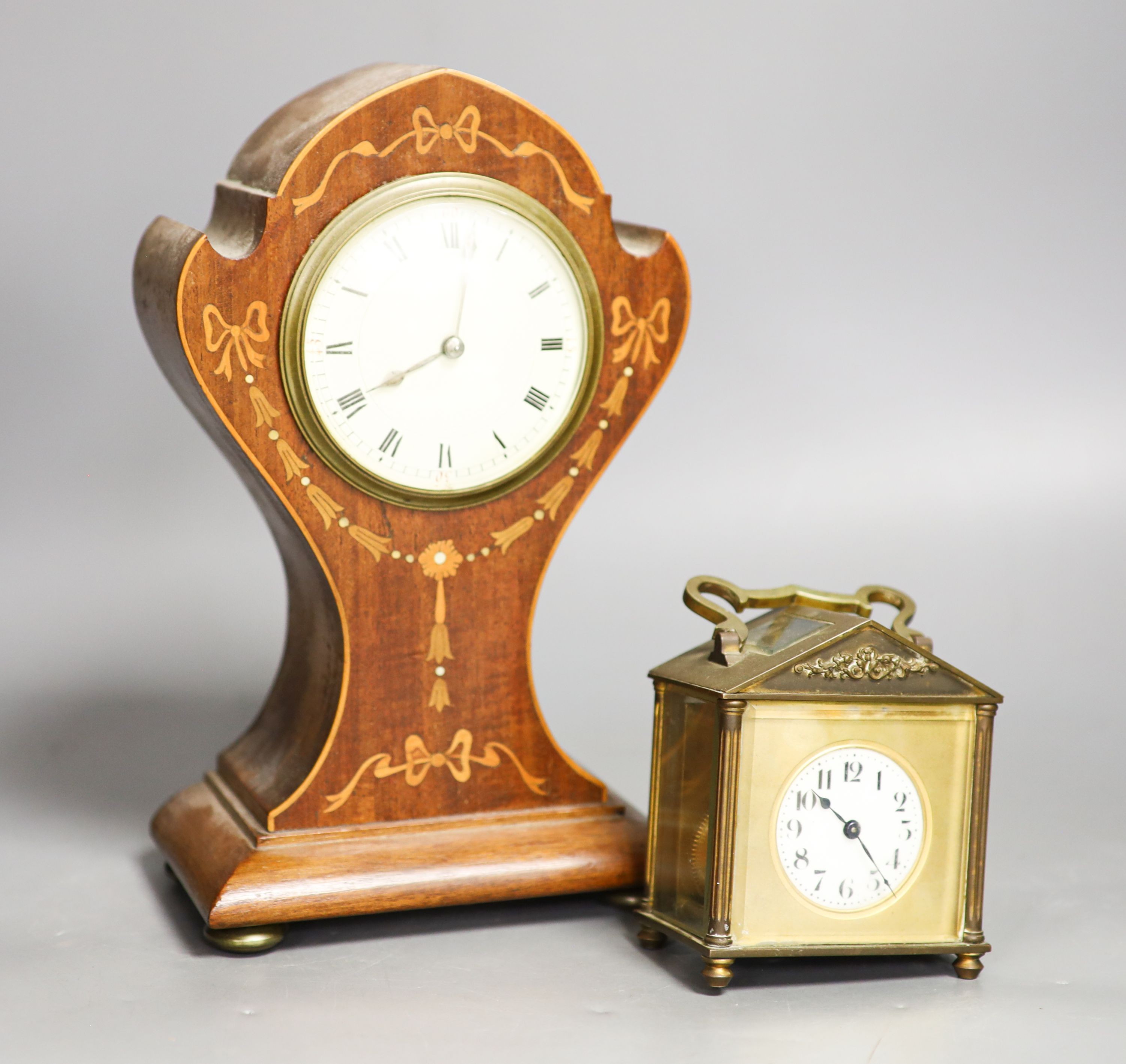 A Edwardian inlaid mahogany mantel timepiece and a brass carriage timepiece